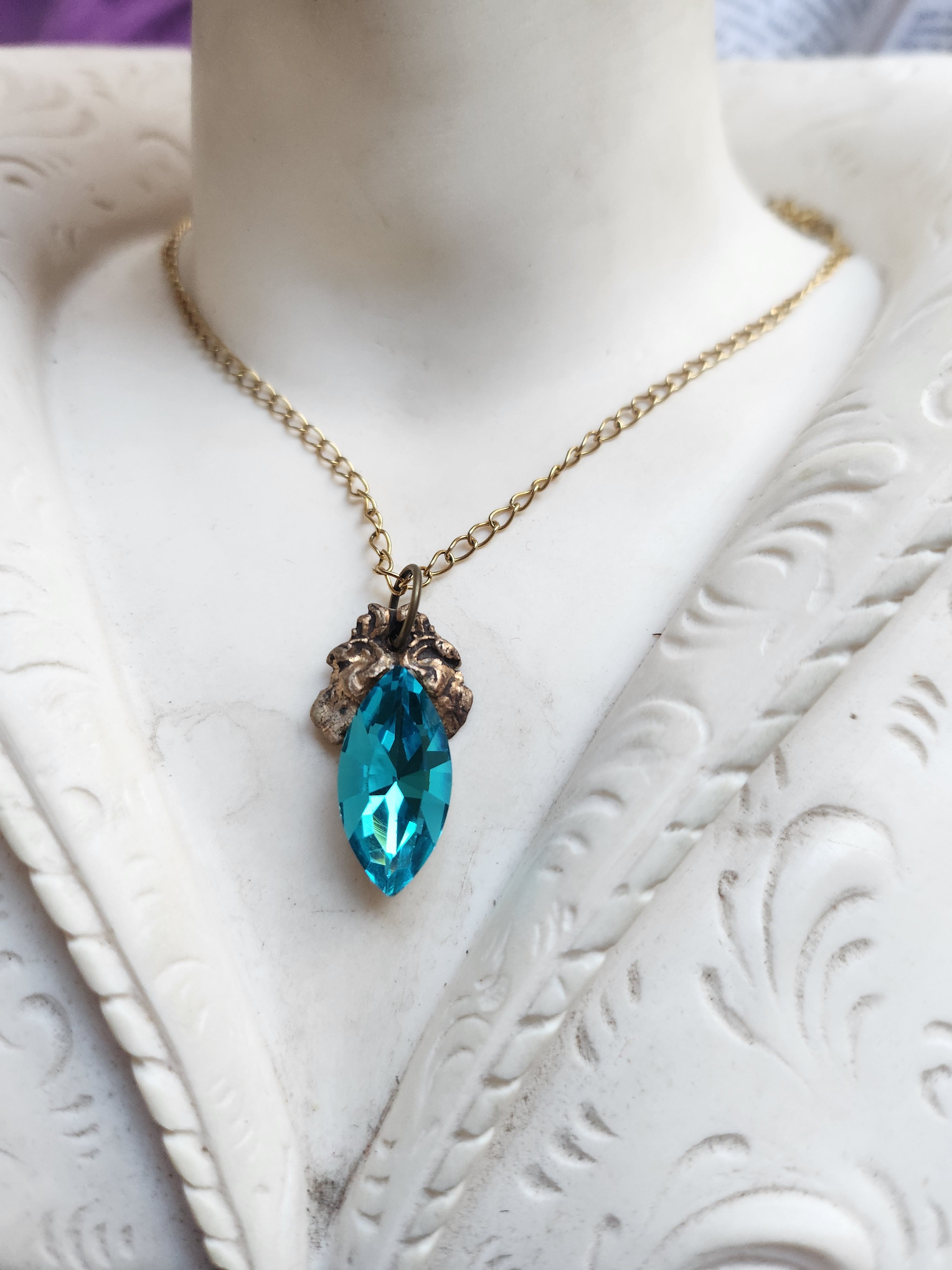 Arcane Resonance Collection – Handmade Bronze Pendant with Electric Blue Navette Crystal