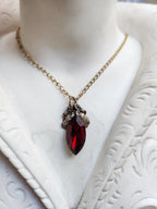 Arcane Resonance Collection – Handmade Bronze Pendant with Deep Red Navette Crystal