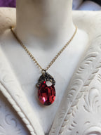 Arcane Resonance Collection – Small Handmade Bronze Pendant with Light Red Oval Crystal