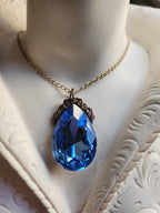 Mystic Baroque Collection – Handmade Bronze Pendant with Light Blue Teardrop Crystal